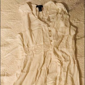 A cream long dress that open on your stomach